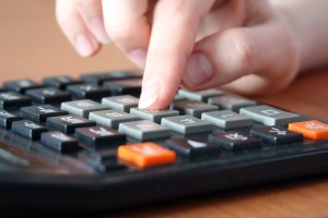 bigstockphoto_Hand_On_The_Calculator_2686754